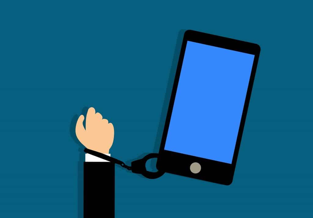 Cartoon of hand handcuffed to a phone