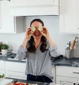 Woman with two limes on eyes smiling and posing for camera