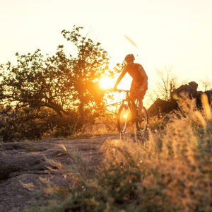 Man riding bike outdoors